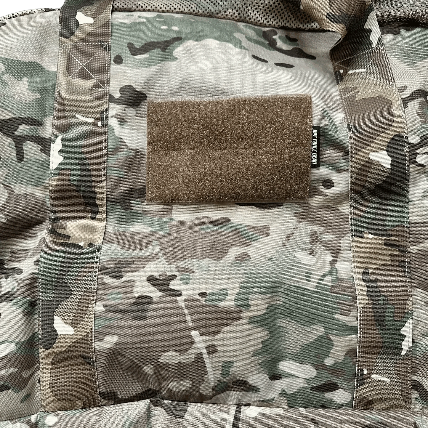 Tactical Duffle Bag in camouflage pattern with Velcro patch area and durable nylon construction.