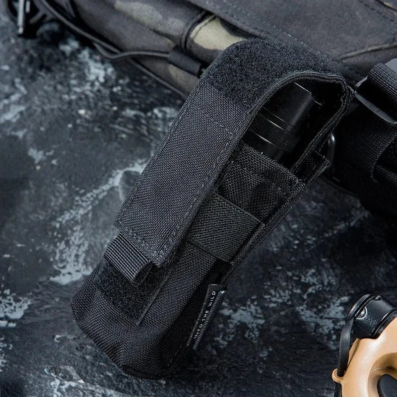 Flashlight pouch with MOLLE system, made of durable 1000D Cordura nylon, securely holding flashlight.