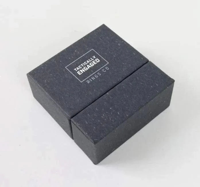Modern minimalist slide ring box in black for jewelry storage.