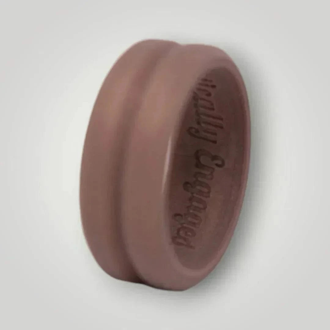 Ridged silicone ring with centered trench, engraved "Tactically Engaged," in bronze color.