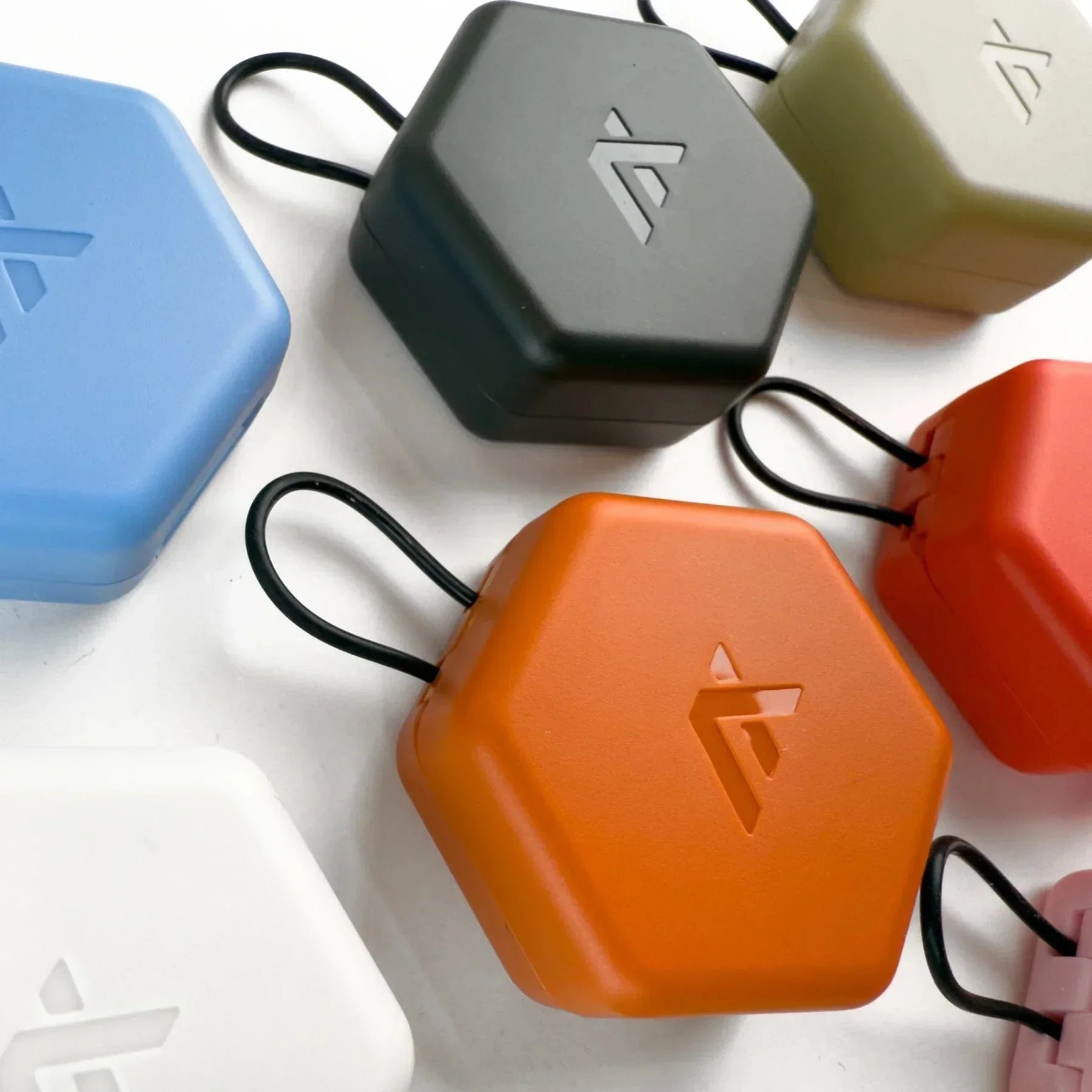 Axil X20 Earplugs in colorful cases, suitable for noise protection in various environments.