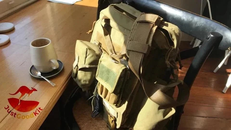 Gift Card by JUSTGOODKIT on a table with a backpack and coffee cup.
