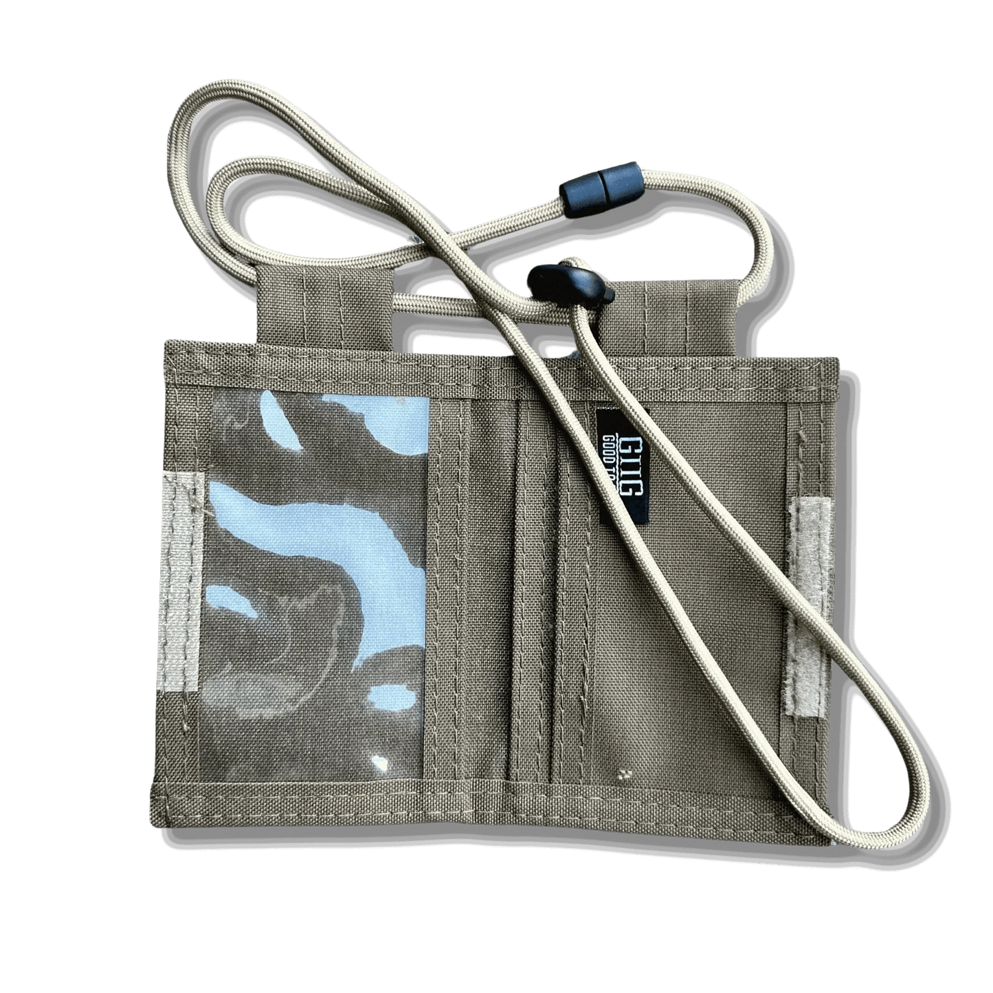 Tactical ID Holder with nylon build and versatile compartments, featuring a PVC window, back pocket, and parachute cord lanyard.
