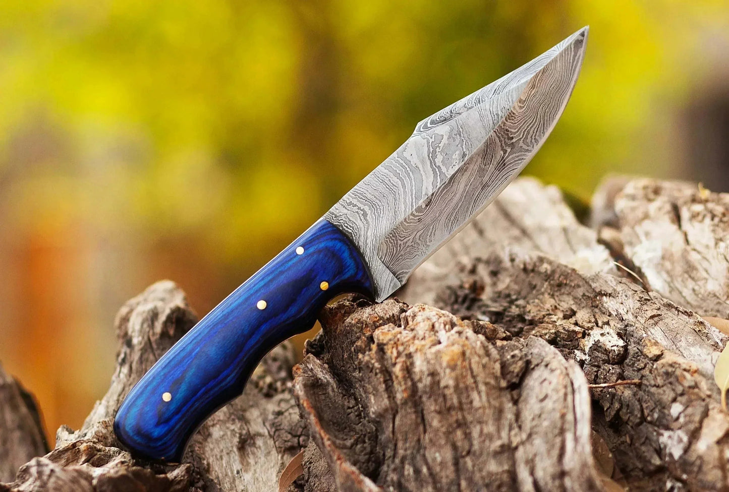 Damascus Steel Hunting Knife with Pattern Welded Blade and Pakka Wood Handle.