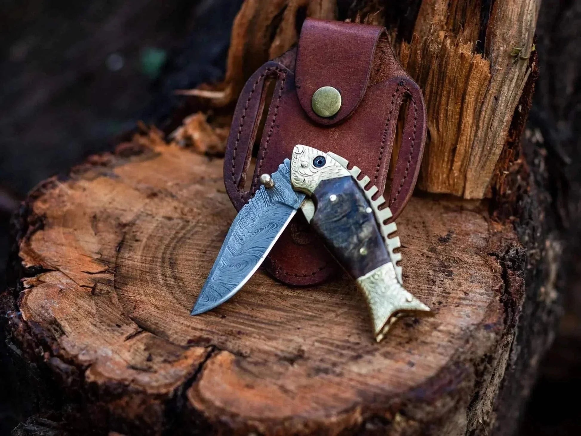 Fish Style Damascus Steel Folding Knife with Leather Sheath on Wood