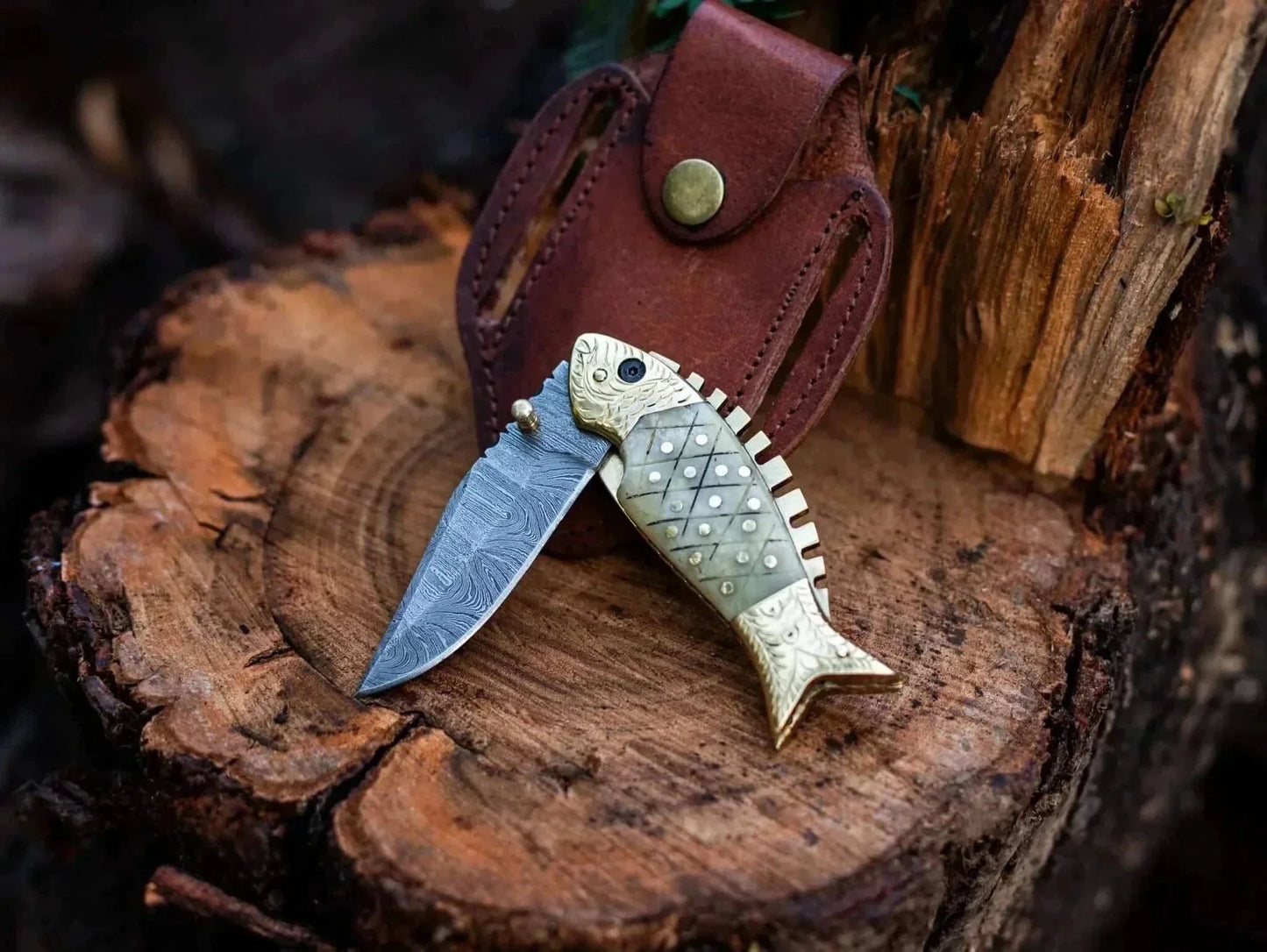 Fish Style Damascus Steel Folding Knife with Leather Sheath on Wood