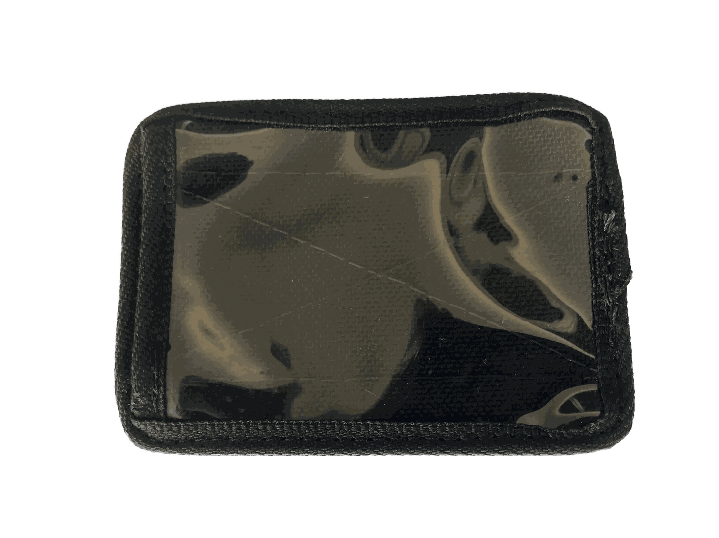 Velcro ID card holder with clear window and black trim for secure attachment.