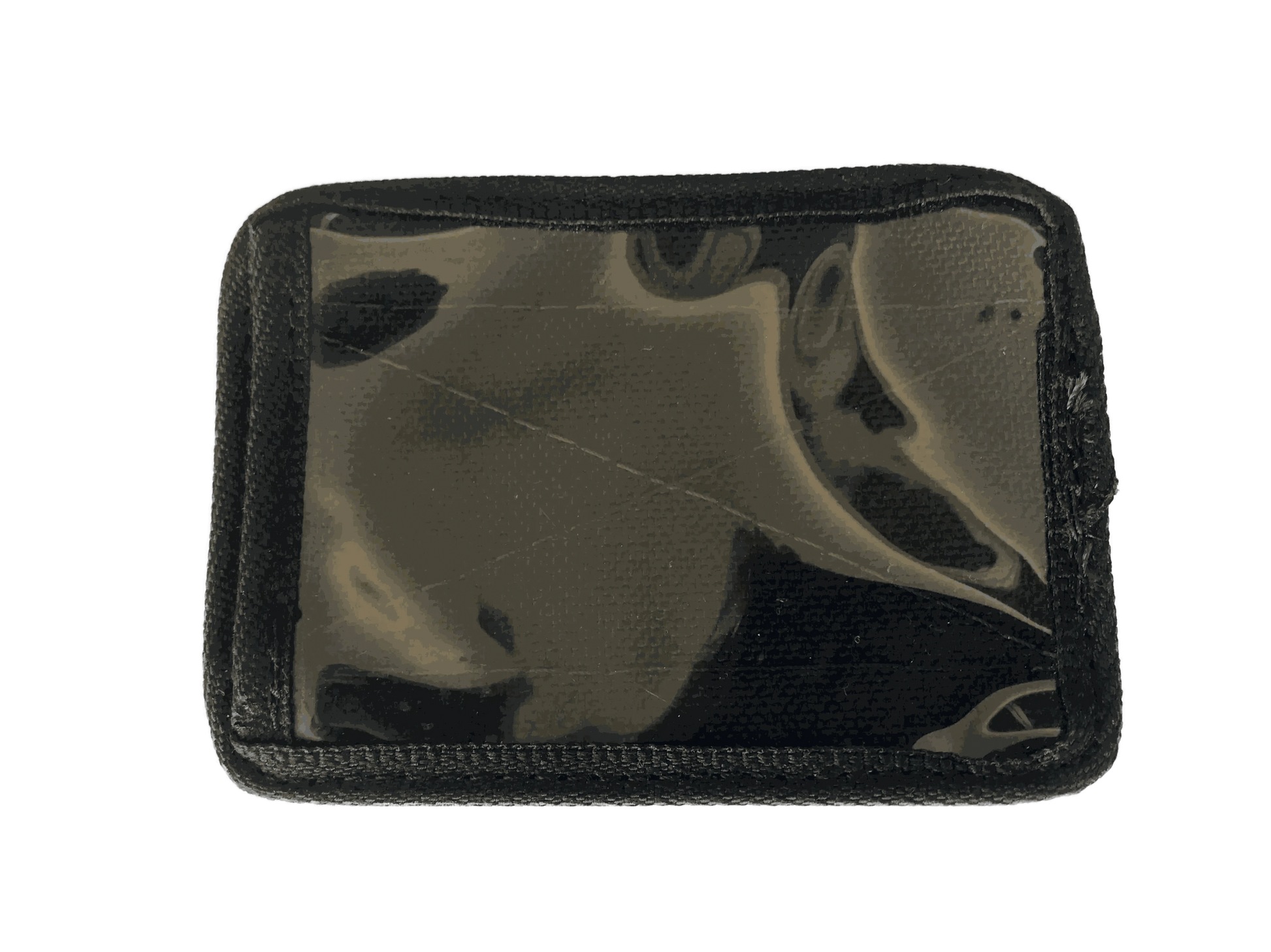 Velcro ID card holder with clear window and black trim for secure attachment.