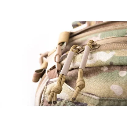 Close-up of a Medium Assault Pack with paracord grip zip pullers.