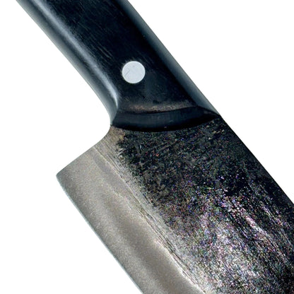 High-carbon steel camping knife with ergonomic handle for outdoor cooking.