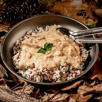 Coconut Ginger Chicken on rice with outdoor background, ideal hiking meal.