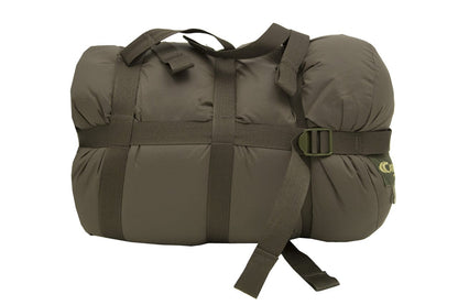 Carinthia Defence 4 Sleeping Bag packed for compact storage, showing olive color and straps.