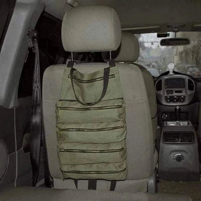 Multifunctional 4WD Tool Bag attached to a car seat backrest showcasing green color and zippered pockets.