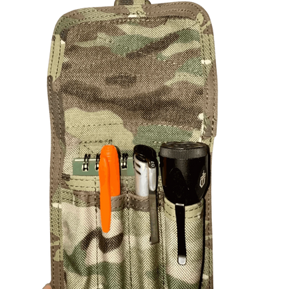 Pen pouch with MOLLE compatibility holding pens and tools, featuring camouflage fabric for tactical use.