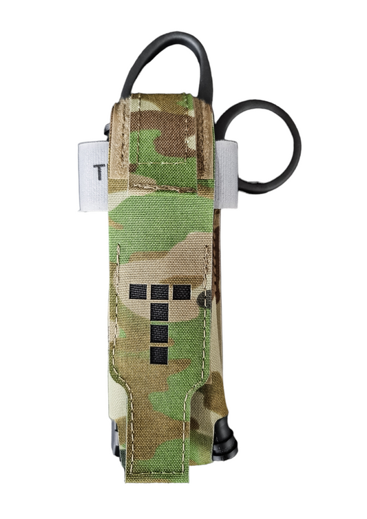 Tourniquet and trauma shears pouch with camouflage design and MOLLE attachment.