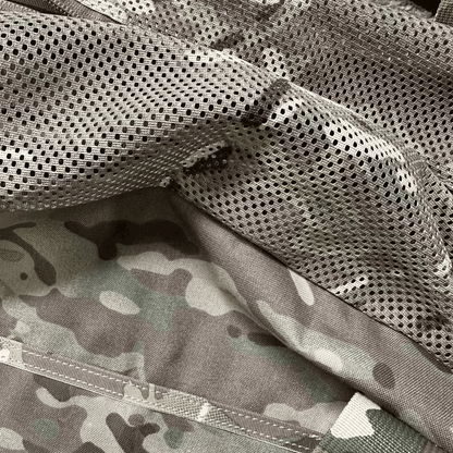 Tactical duffle bag with ventilated mesh top and camouflage pattern.