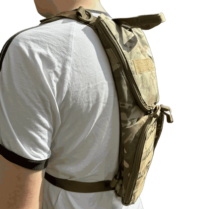 Multicam hydration backpack worn by person for outdoor adventures.