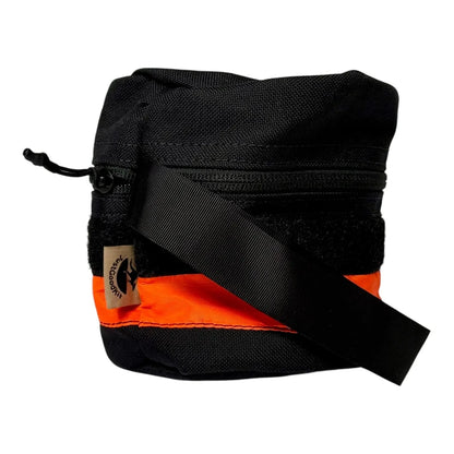 Water-resistant nylon toilet roll storage with wristband and reflective tape.