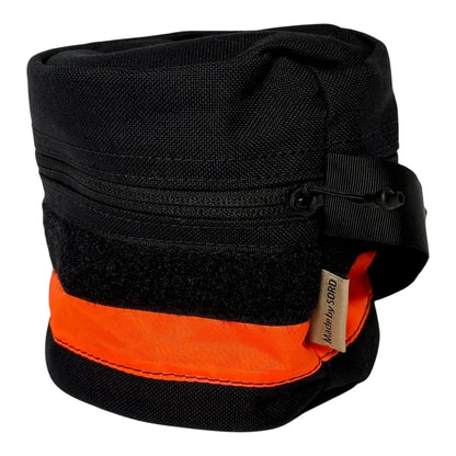 Durable water-resistant nylon toilet roll storage with wristband and reflective tape.