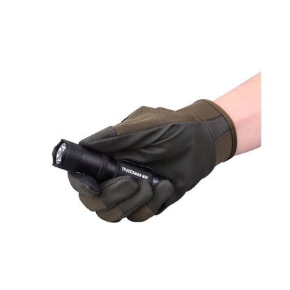Powertac Tradesman M6-Gen3 flashlight held in gloved hand, compact EDC light with magnetic tail cap.