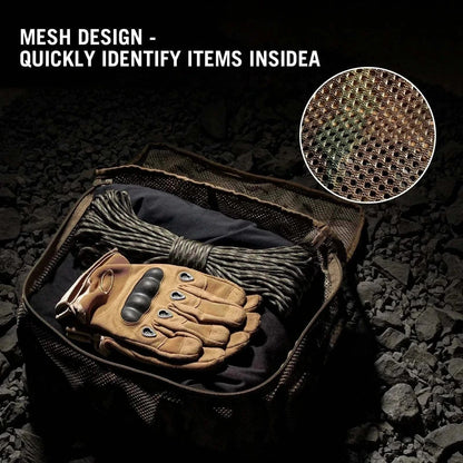 Mesh design backpack organiser displaying contents and gloves on rocky surface.