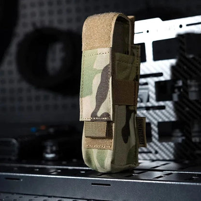 Camouflage flashlight holster pouch with MOLLE system, made from durable 1000D Cordura nylon.