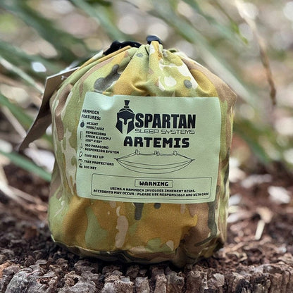 Spartan Artemis Ultra-Light Bug-Net Hammock in camouflage stuff sack, ideal for camping and backpacking.
