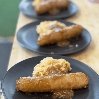 Sausages with mashed potatoes on plates