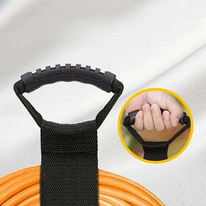 Electrical extension cord carry handle with rubber grip and nylon strap.