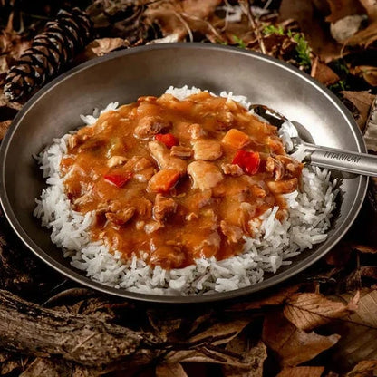 Slow-cooked sweet and sour pork on rice, ideal hiking food.