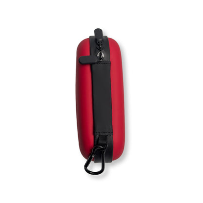 Hard shell compact first aid kit in durable red case with zipper and carabiner.