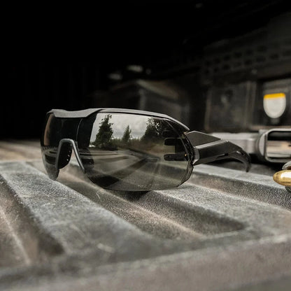 Edge Eyewear Tactical Kabru glasses featuring ballistic protection and anti-fog technology on a truck bed.