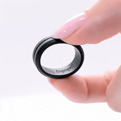 Black silicone ring with centered trench and bevelled edges, engraved with "Tactically Engaged."