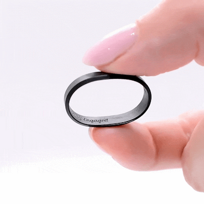Ultra-thin beveled black silicone ring with internal engraving, lightweight and flexible.