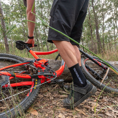 Cyclist wearing TacSource Active Train 2.0 Socks during outdoor ride.