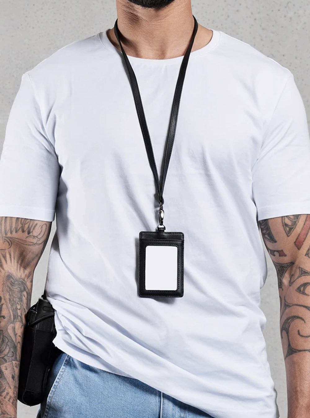 TacSource recycled leather ID holder worn on a lanyard.