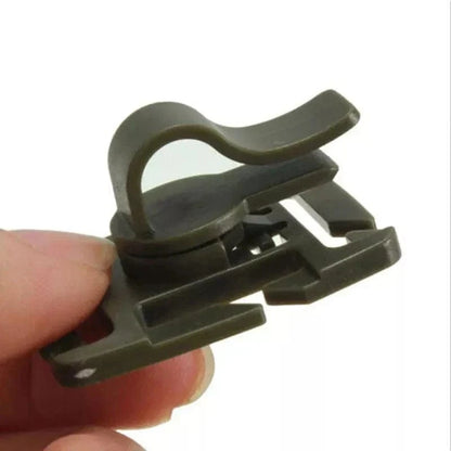 MOLLE Clip for Hydration Tube held in hand, showcasing tangle-free and durable design.