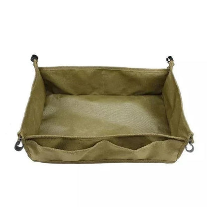 Portable camping table unfolded in a khaki color with durable Oxford cloth, ideal for outdoor use.
