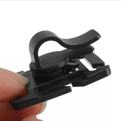 MOLLE clip for hydration tube, black plastic, tangle-free design, PALS/MOLLE compatible.