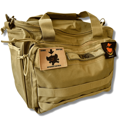 Australian Drop Bear Tactical Morale Patch on tan tactical bag with Velcro attachments.
