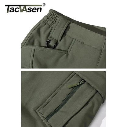 Olive green tactical hiking pants with multiple pockets and zipper detail for cold-weather adventures.