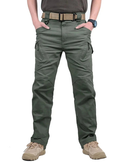 Men's tactical pants with multiple pockets, ideal for outdoor activities, military-style in green.