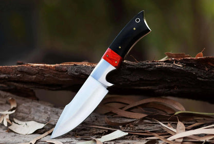 High carbon steel hunting knife with bull horn and pakka wood handle, full tang design.