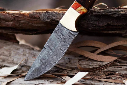 Damascus Steel Hunting Knife with handcrafted blade and wooden handle.
