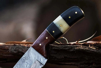 Damascus Steel Hunting Knife with Pakka Wood handle and custom Damascus bolster.