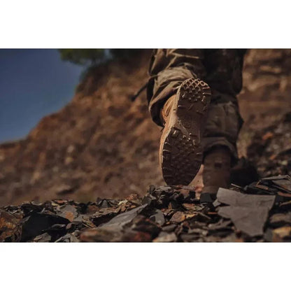 Boot sole of NFS Tactical Boot traversing rocky terrain.