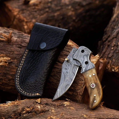 Damascus Steel Folding Knife with Ram White Horn handle and crocodile leather sheath.