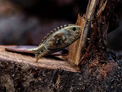 Fish Style Damascus Steel Folding Knife on wood, unique fish-shaped design, Damascus blade, bone and brass handle.