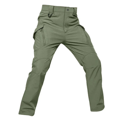 Men's tactical hiking pants in green, fleece-lined for warmth, waterproof and windproof, with multiple cargo pockets.