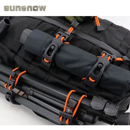 Multi-Purpose MOLLE Webbing Buckle Clip securing gear on black tactical backpack.